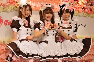 waitresses wearing their new uniforms at a meido cafe in tokyo's akihabara neighborhood