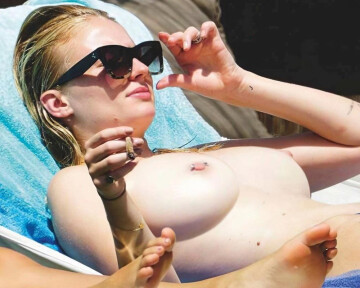 sophie turner doesn't want any tan lines on her enhanced chest.