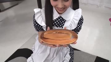 cute asian eats a hotdog