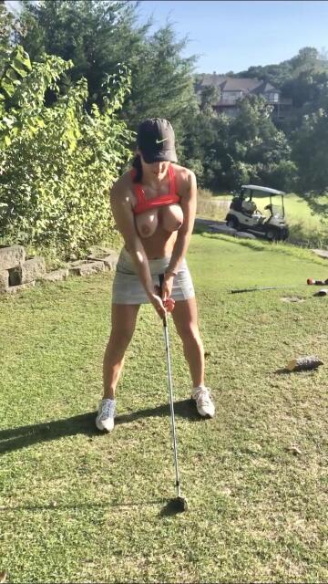 just a sneaky mom golfing with her boobs out!
