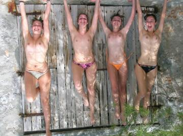 four topless girls ... upside down?