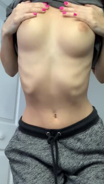 petite brunette showing her tits and ass