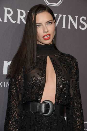 adriana lima has such a sexy face. i want to put my cock in those amazing red lips and fuck her until i explode huge load of cum deep in her throat.