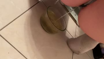 pouring a full bowl of piss on my slaves face :)