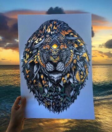 artist draws lion and makes cut outs to have image colored by its background