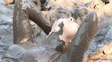 she looks so happy to smear mud into her hair