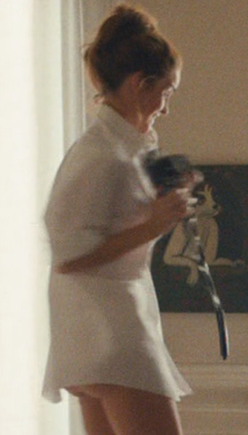 emma watson with a glimpse of her cheeks.