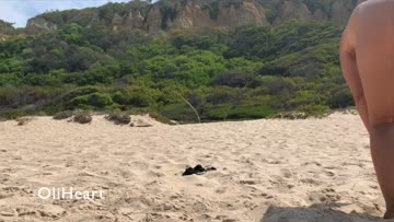 playing at the beach completely naked