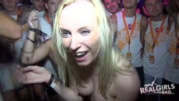 blonde getting topless in a club