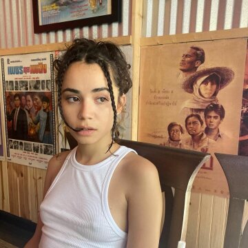 poking through a white top