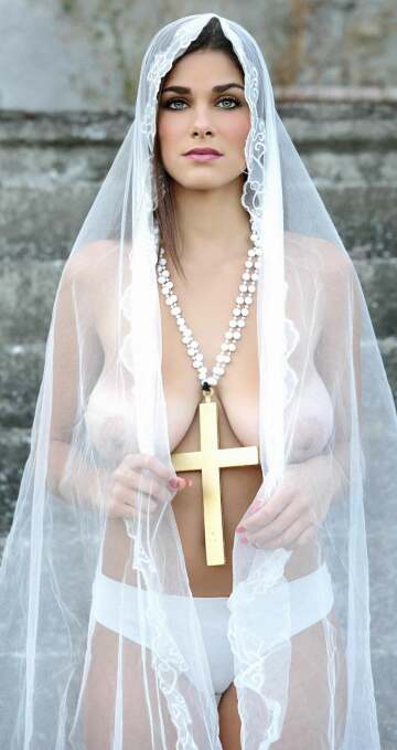 good christian girl wearing her cross and veil