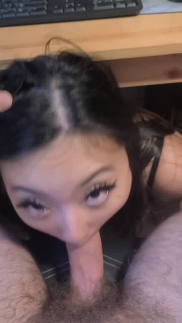 supporting him from under the desk