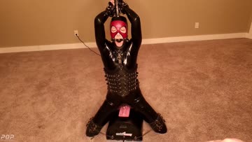 tied and gagged in latex on a motor bunny (sybian)!
