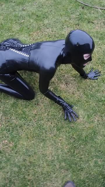 the rubber doll is taken out for a walk in the park